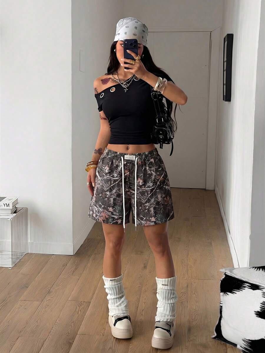 Women's casual drawstring track shorts featuring front pockets and embroidered details