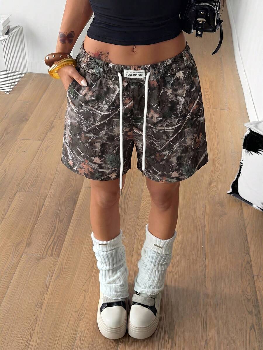 Women's casual drawstring track shorts featuring front pockets and embroidered details