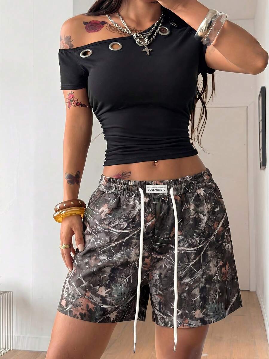 Women's casual drawstring track shorts featuring front pockets and embroidered details
