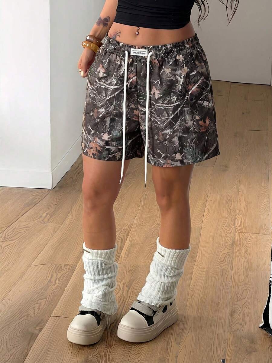 Women's casual drawstring track shorts featuring front pockets and embroidered details
