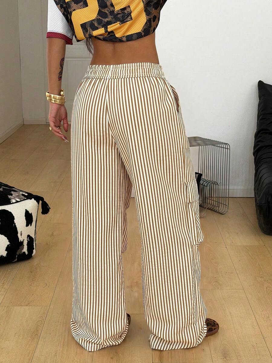 Women's black and white striped wide leg pants featuring an elastic drawstring waistband, side pockets, and a loose straight leg fit.