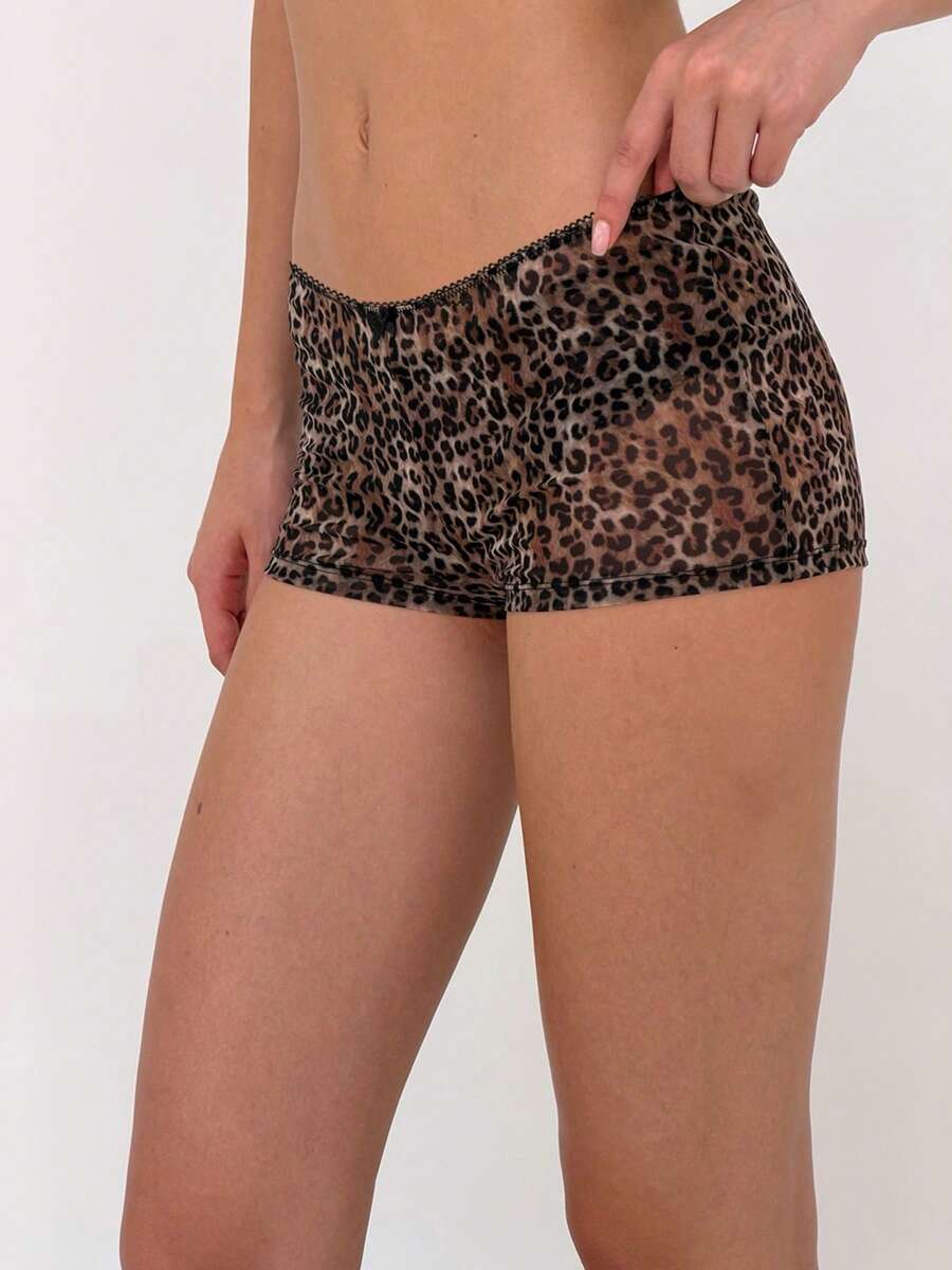 Brown leopard print two-piece outfit with a backless halter camisole top and matching high-stretch semi-sheer shorts.