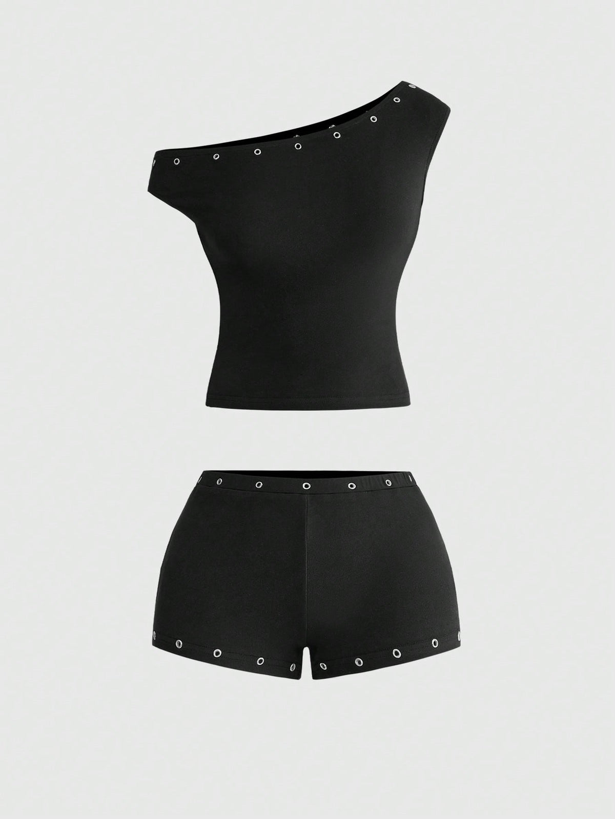 Women's two-piece outfit with an asymmetric neck studded grommet crop top and super low-rise mini shorts