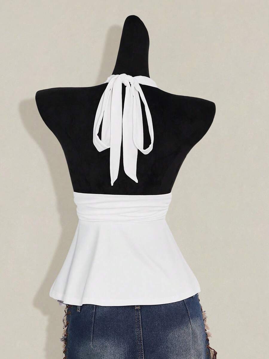 Women's backless halter babydoll tank top featuring a square neckline, slim fit silhouette, and a flared ruffle hem.