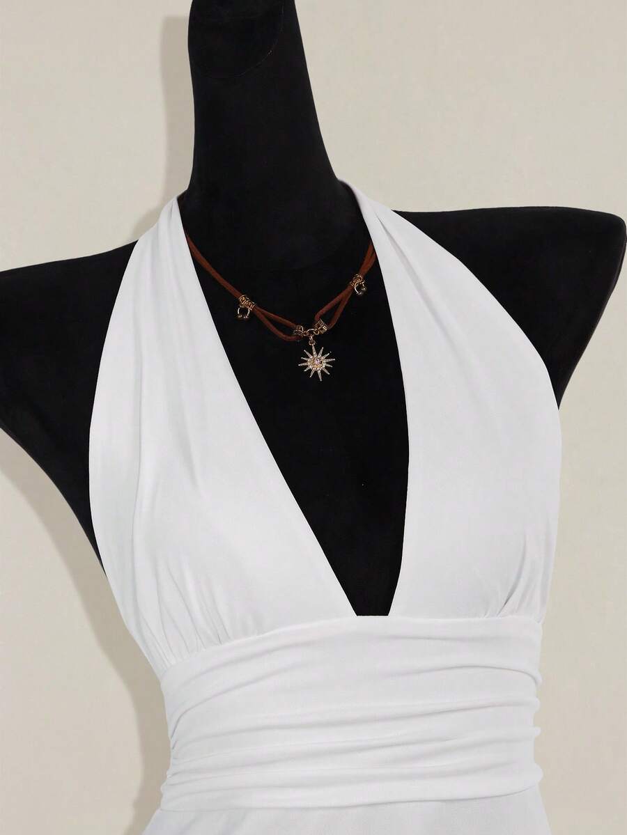 Women's backless halter babydoll tank top featuring a square neckline, slim fit silhouette, and a flared ruffle hem.