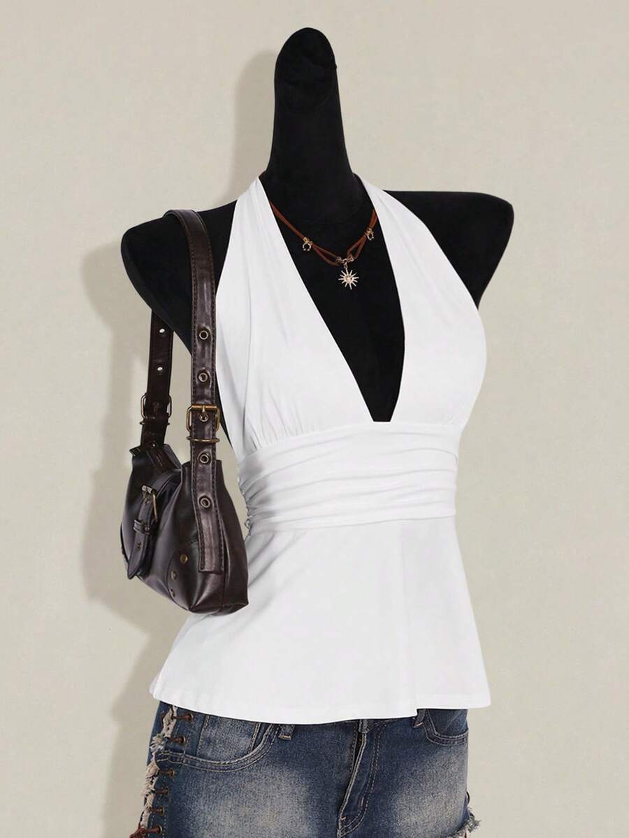 Women's backless halter babydoll tank top featuring a square neckline, slim fit silhouette, and a flared ruffle hem.