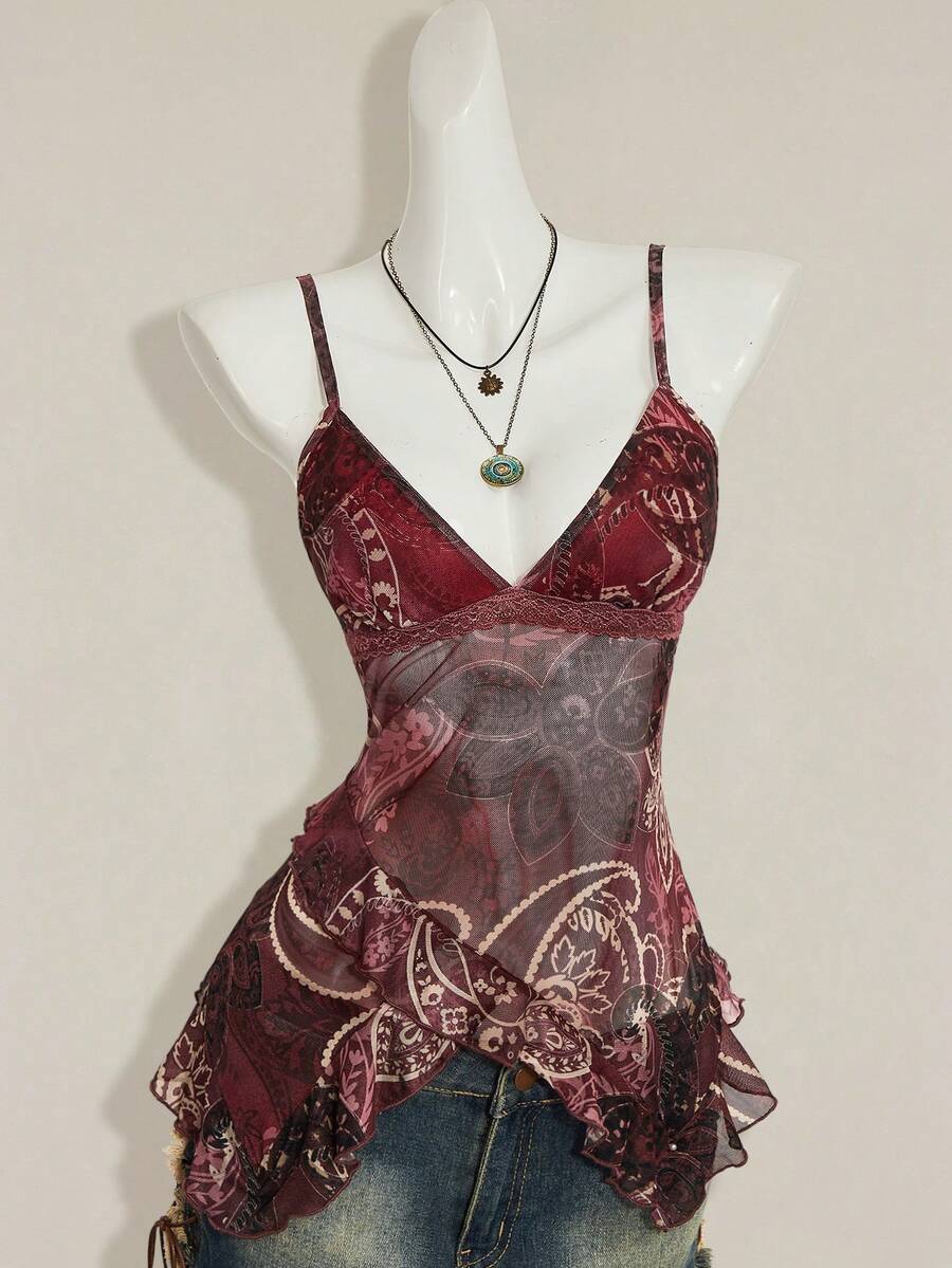 Women's graphic print camisole top featuring thin spaghetti straps, a backless cut, and an asymmetrical hem.