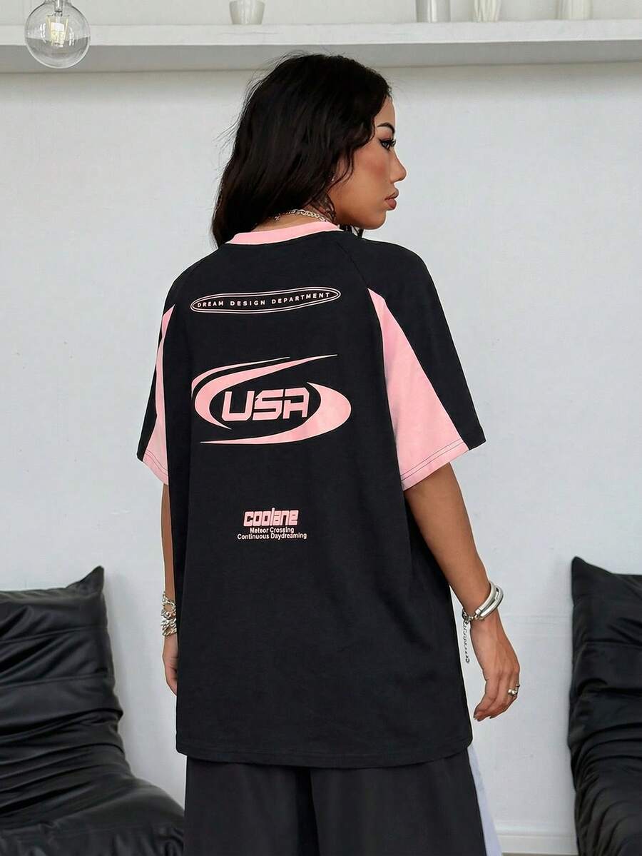 Unisex plus size oversized jersey t-shirt in brown featuring a round neck, short raglan sleeves with contrast binding, and a front letter graphic print.