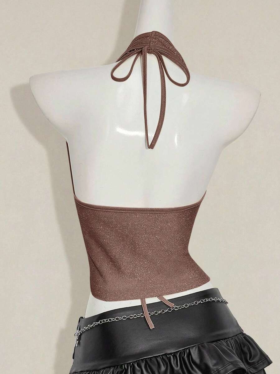 Women's glitter halter backless micro crop tank top featuring a draped knot front design.
