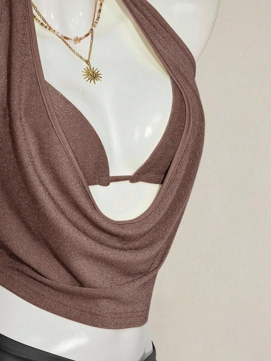 Women's glitter halter backless micro crop tank top featuring a draped knot front design.