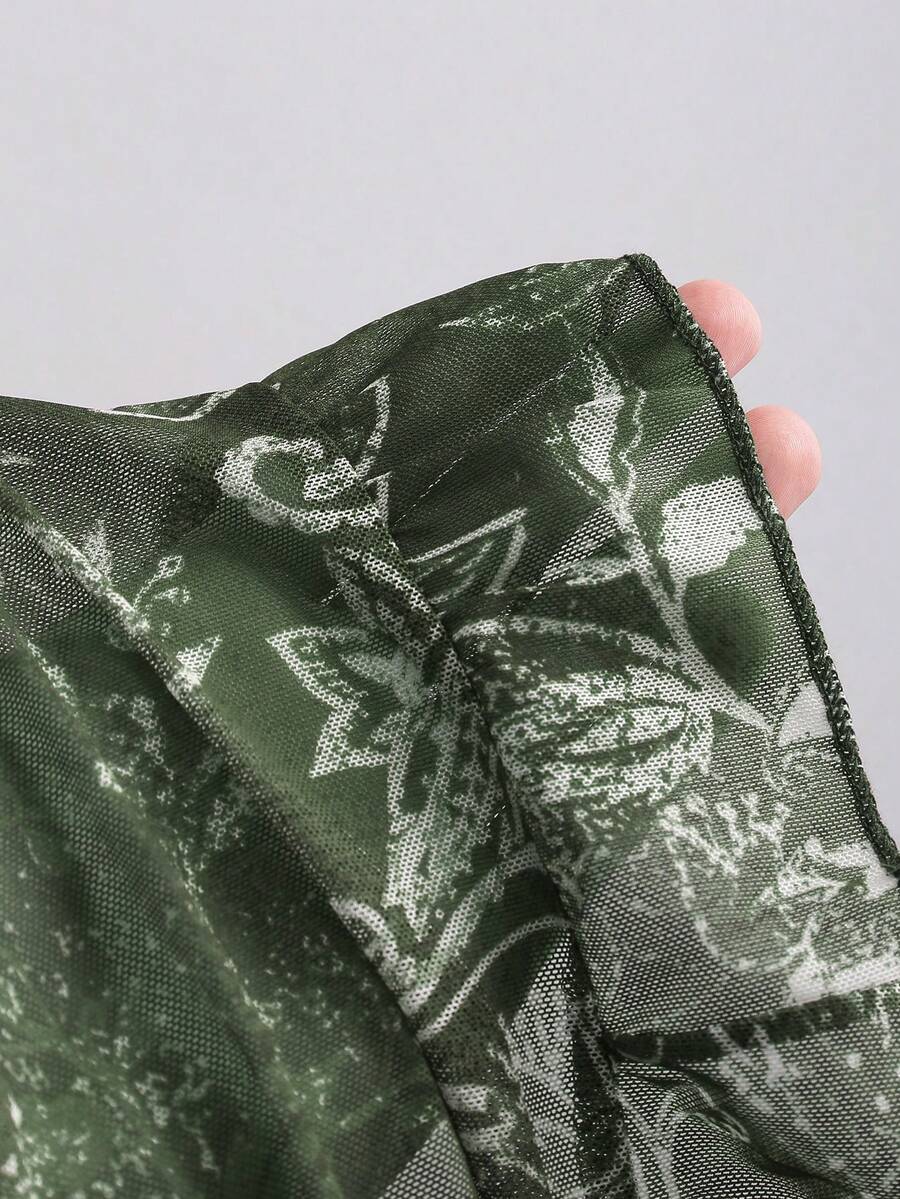 Women's vintage printed mesh ruffle strap camisole top in Army Green featuring cold shoulder style, spaghetti straps, jacquard pattern detail, and a slim crop fit.