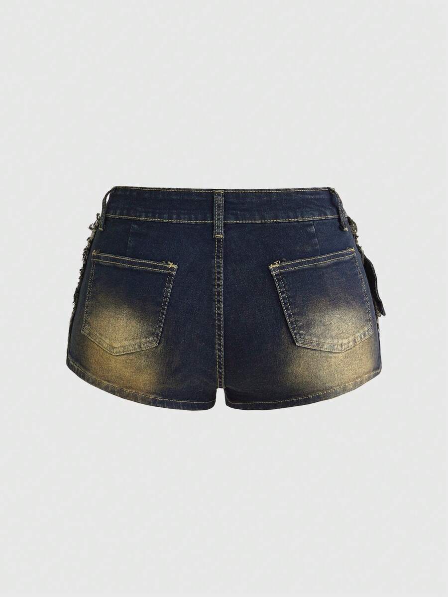 Black grunge punk low-waist mini shorts with studded details and zipper fly closure
