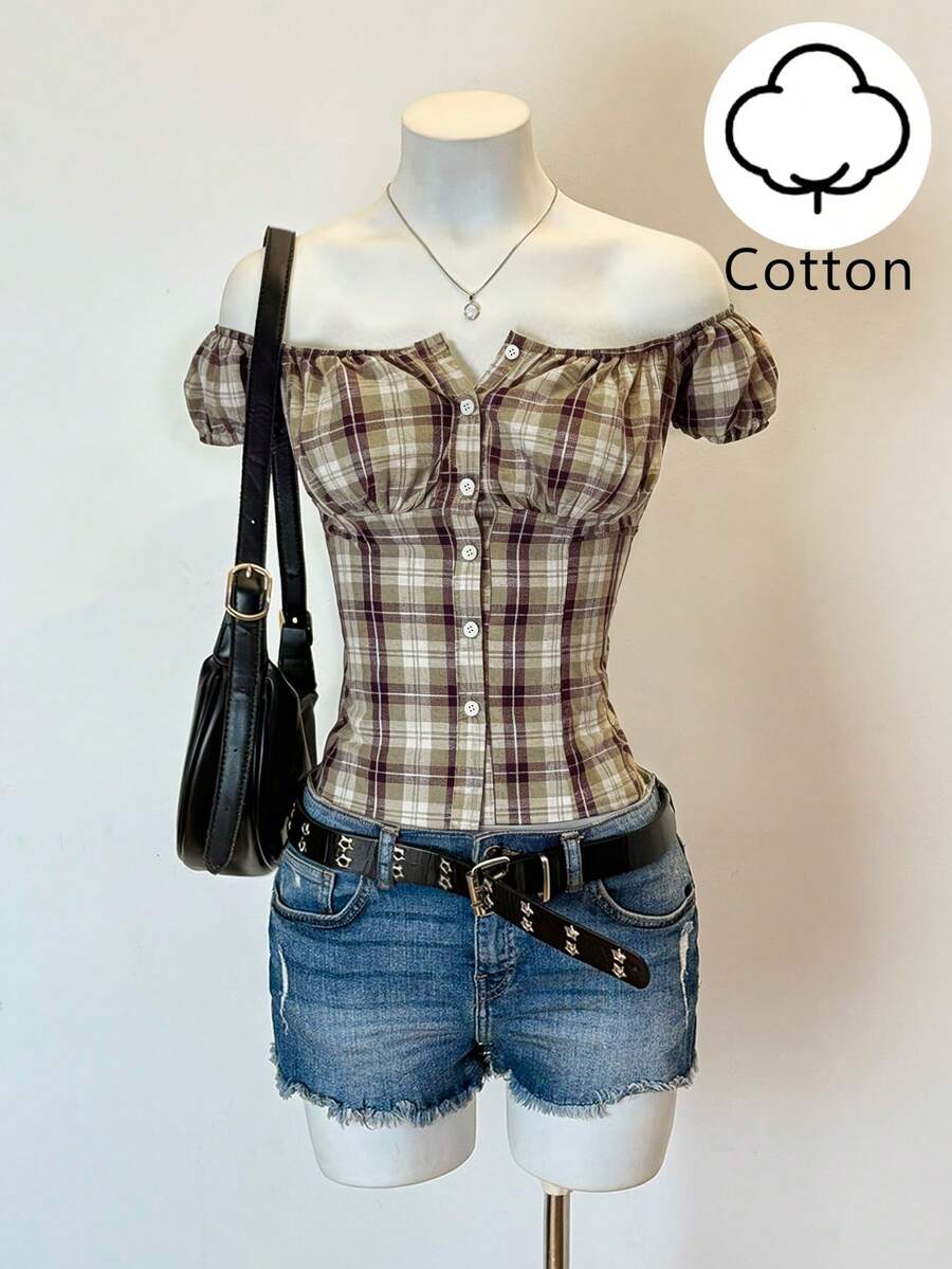 Women's army green plaid off-the-shoulder shirt with short puff sleeves, front button closure, flared hem, and lace-up grommet eyelet details.