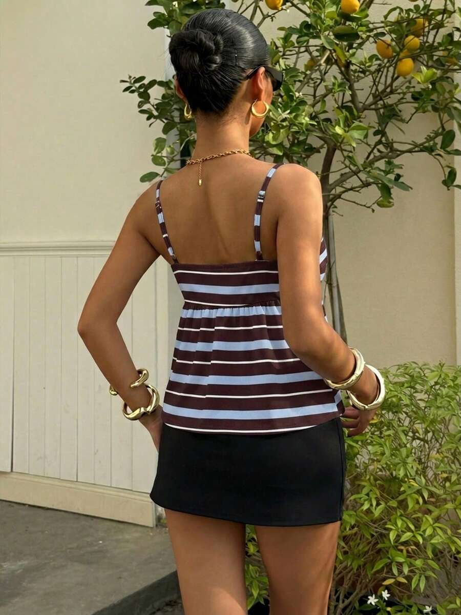 Women's casual geometric cami top with spaghetti straps, backless wrap styling, button front, and asymmetrical hem.