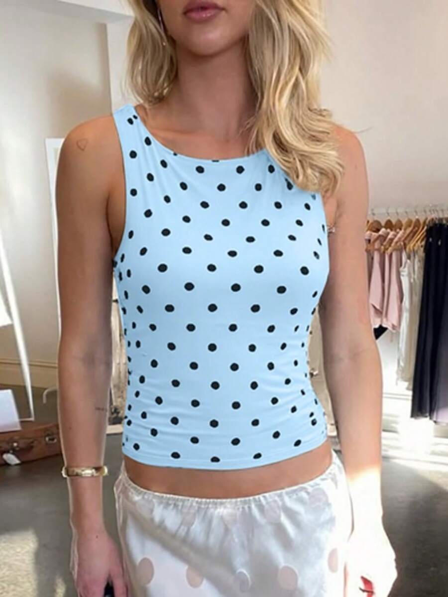 Women's polka dot sleeveless tank top with round neck, ruched rib-knit detail, regular hem, and slim fit casual style