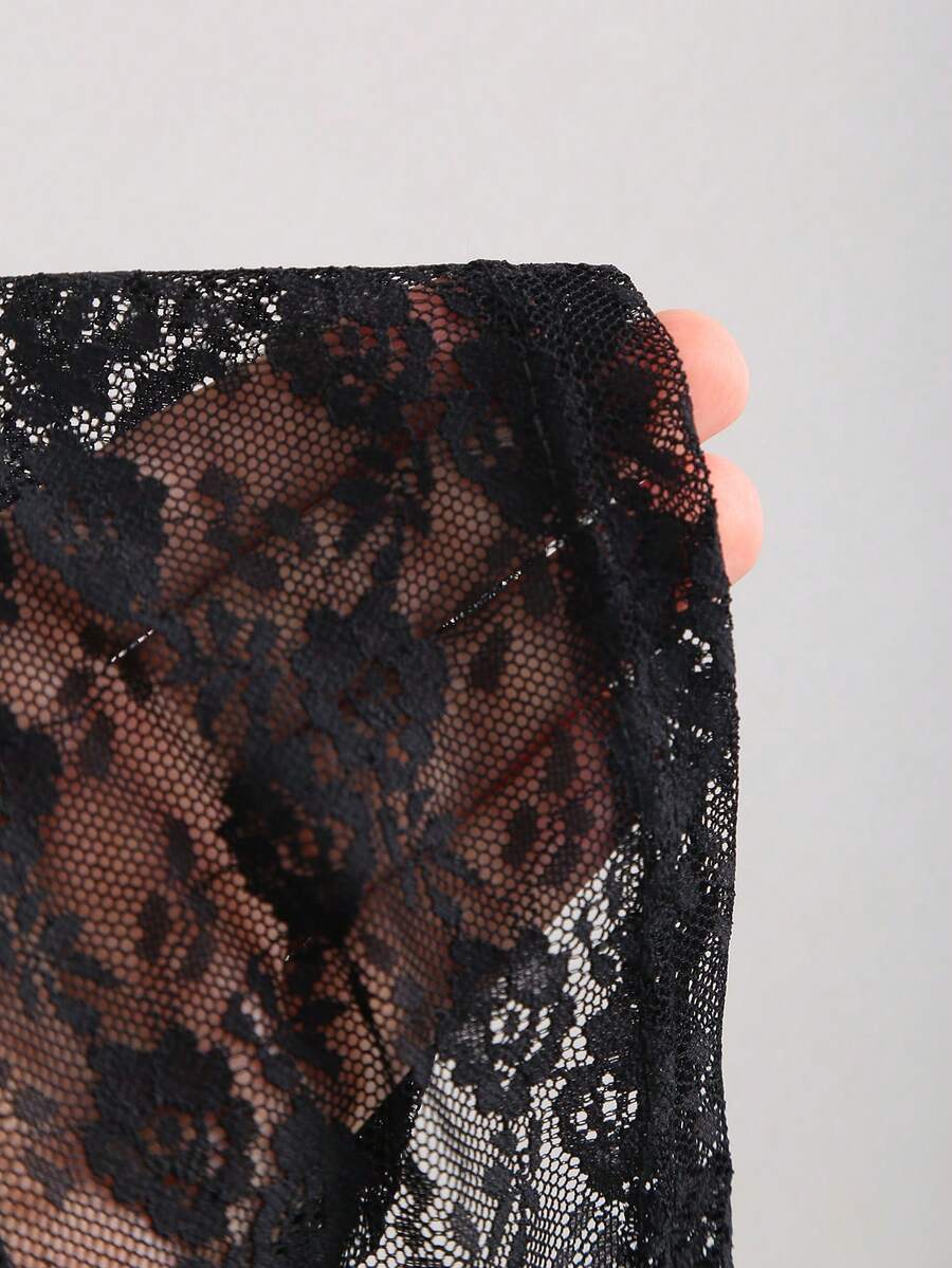 Women's black lace halter crop camisole featuring tie-back details, slim fit design, and matching arm sleeves.