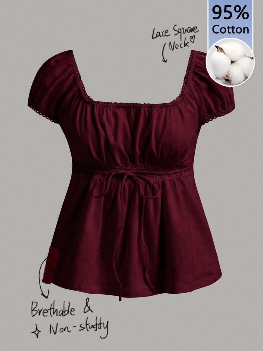 Women's black short puff sleeve top featuring a square neckline, ruched bust detail, and flared ruffle hem.