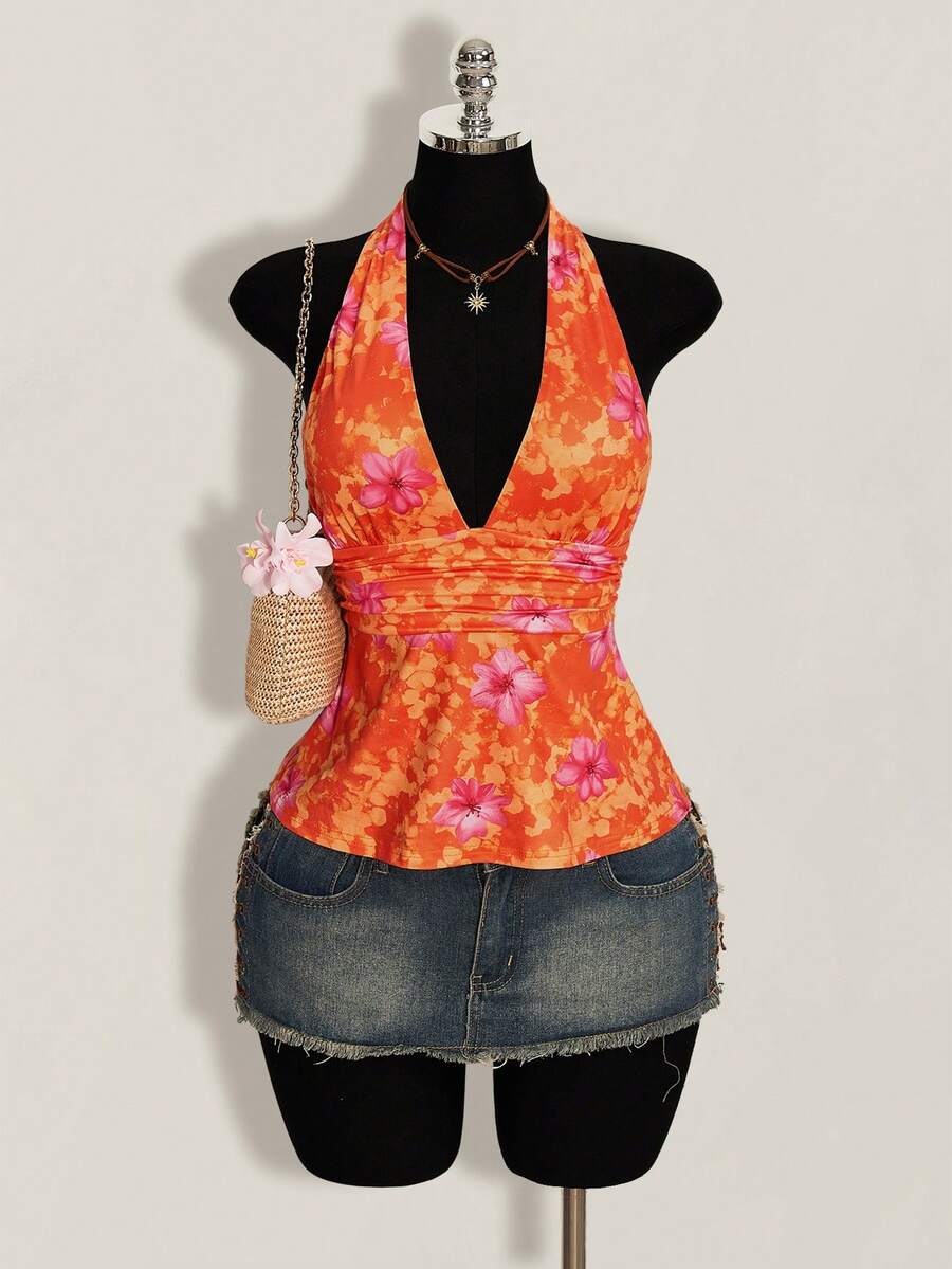 White women's deep V-neck halter tank top with ruched waist, backless design, rib-knit texture, and ruffle hem