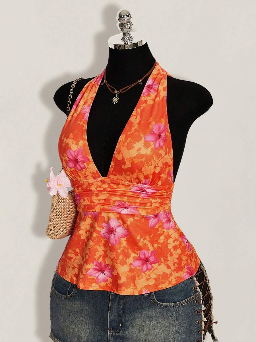 White women's deep V-neck halter tank top with ruched waist, backless design, rib-knit texture, and ruffle hem