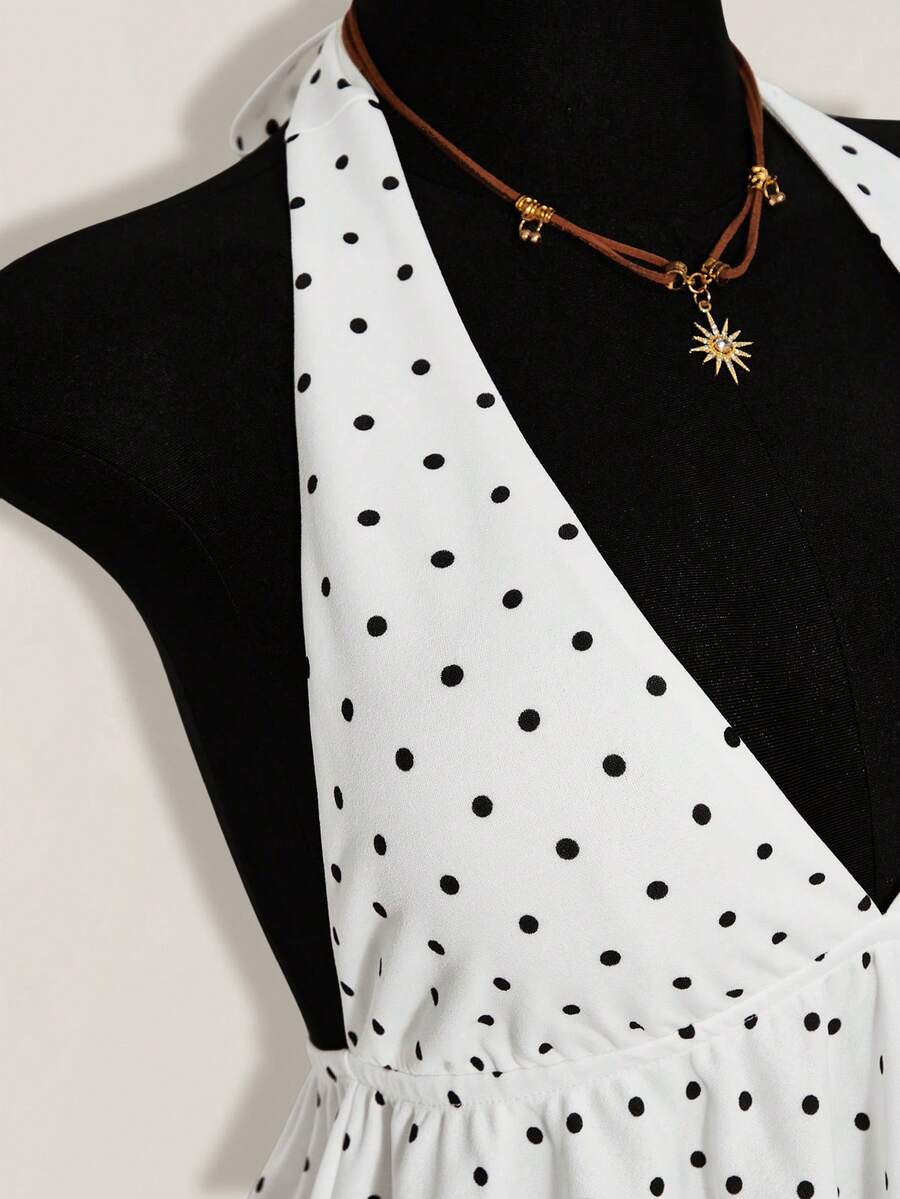 Women's polka dot print halter camisole with backless knot detail, ruched front, slim fit, and flared ruffle hem
