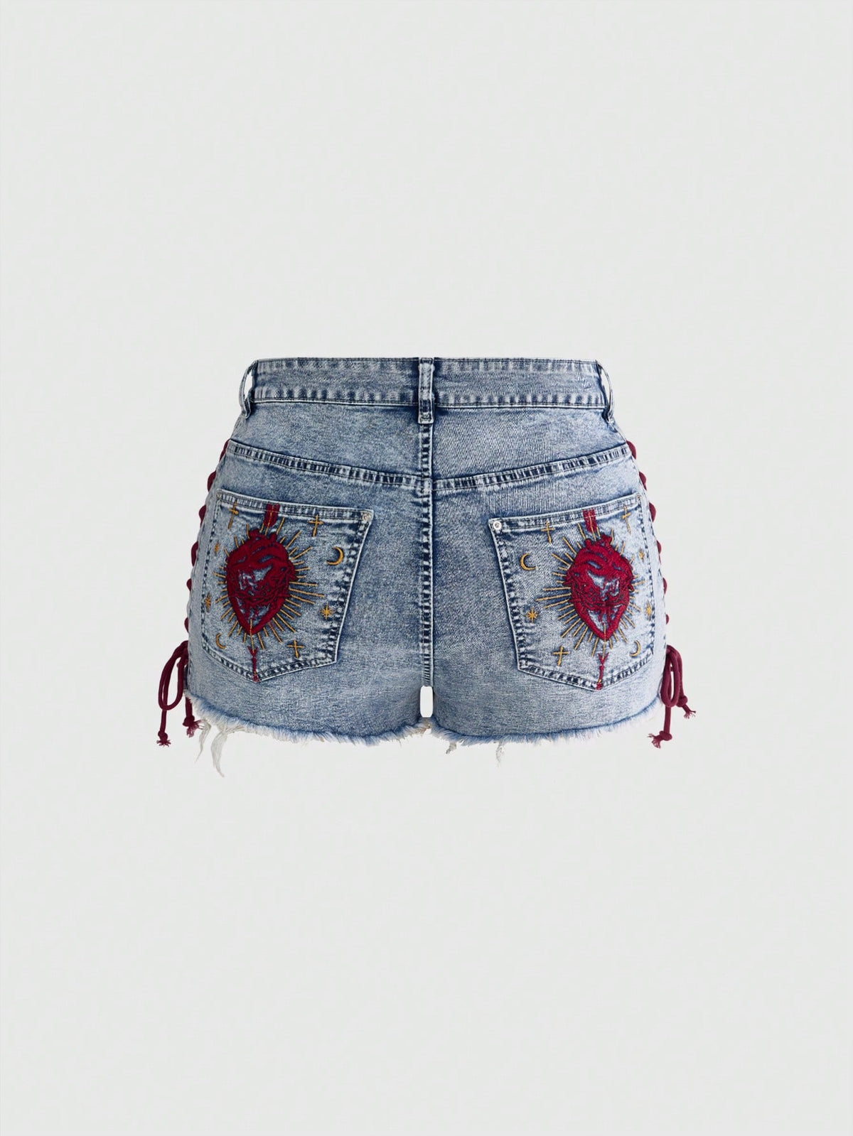 Plus size black gothic mini shorts with heart embroidery, graphic pocket pattern, lace-up detail, raw hem, and zipper fly