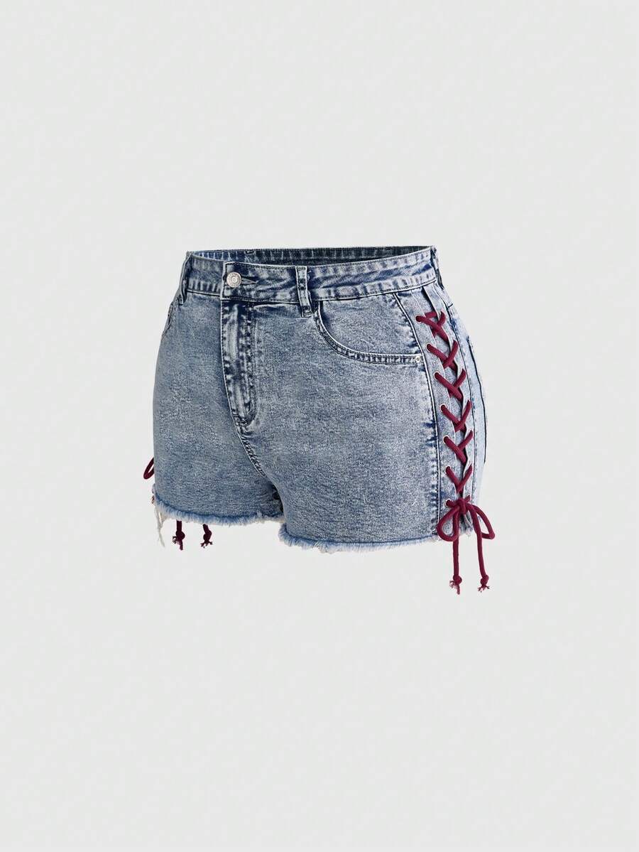 Plus size black gothic mini shorts with heart embroidery, graphic pocket pattern, lace-up detail, raw hem, and zipper fly