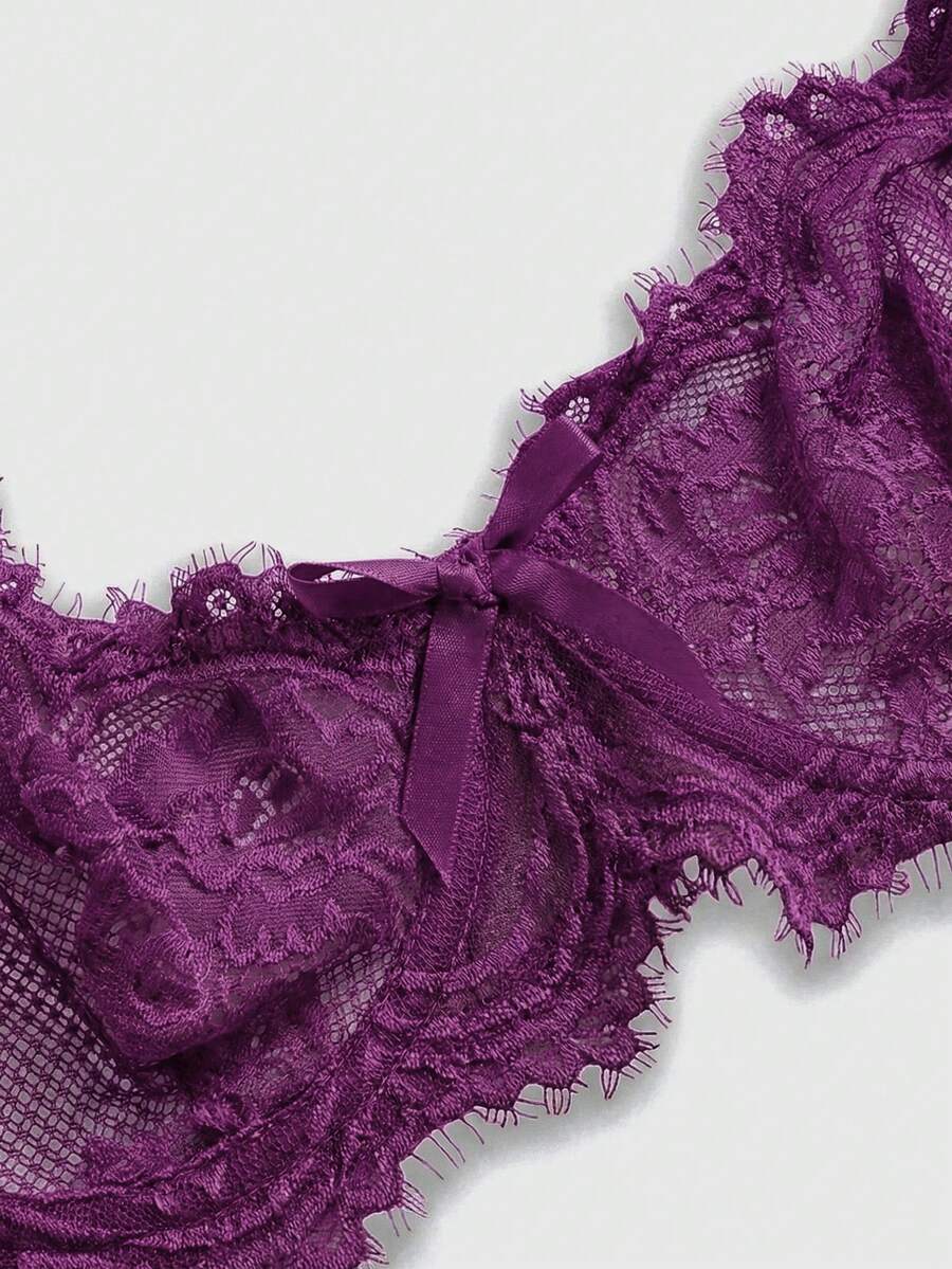 Sheer floral lace underwire triangle bra for women featuring adjustable straps and plunge cup design.