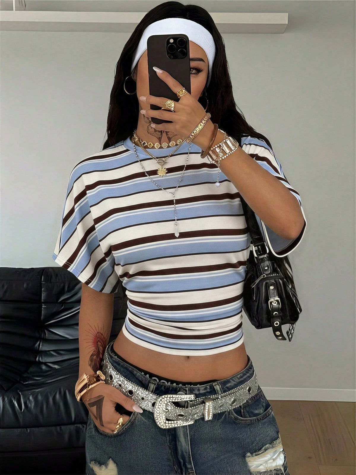 Women's striped short sleeve t-shirt featuring a casual drop shoulder design and round neckline.