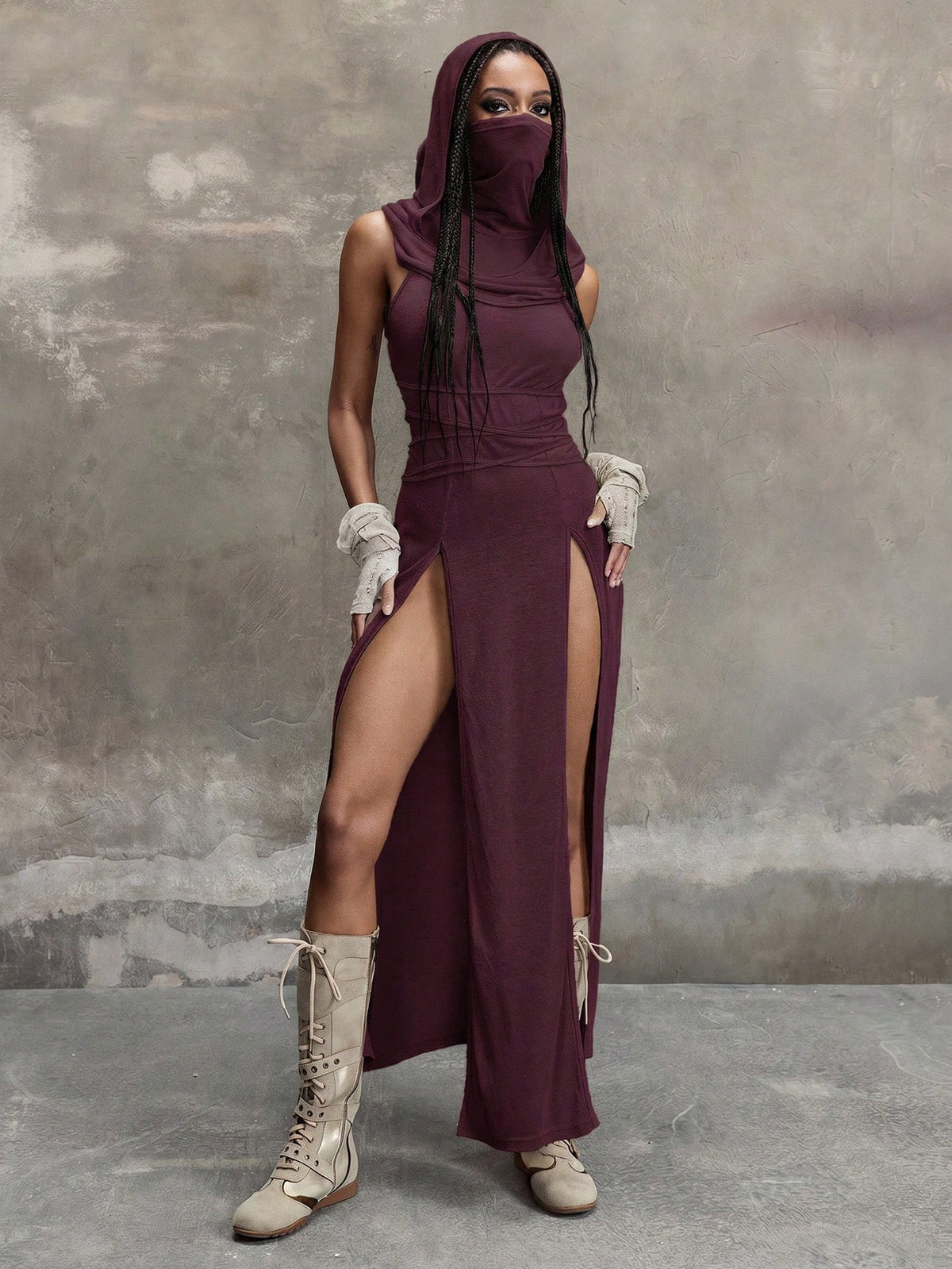 Women's sleeveless hooded maxi dress featuring a plunging neckline, backless design, and high thigh split in a lightweight knit fabric.