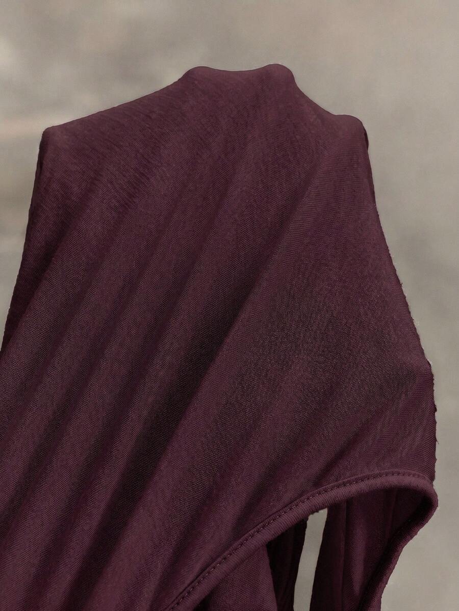 Women's sleeveless hooded maxi dress featuring a plunging neckline, backless design, and high thigh split in a lightweight knit fabric.