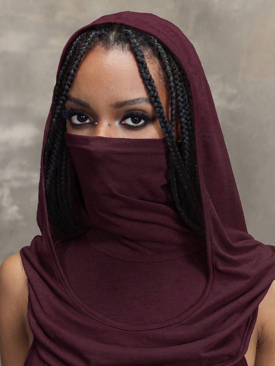 Women's sleeveless hooded maxi dress featuring a plunging neckline, backless design, and high thigh split in a lightweight knit fabric.