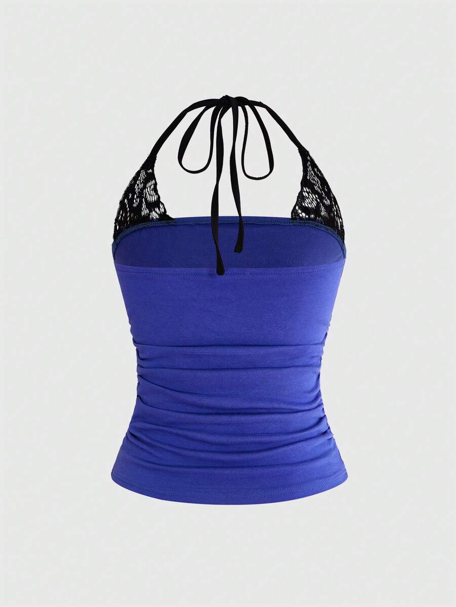 Women's cropped Y2K punk print halter cami top with contrast lace, backless knot detail, and slim fit knitted fabric