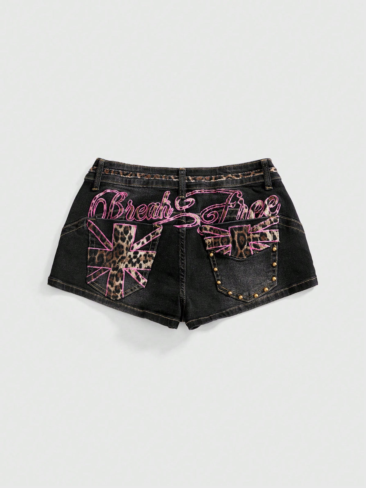 Women's super low waist shorts with leopard print embroidery, button and zipper closure, and raw hem detailing.