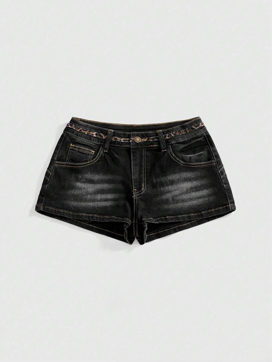 Women's super low waist shorts with leopard print embroidery, button and zipper closure, and raw hem detailing.