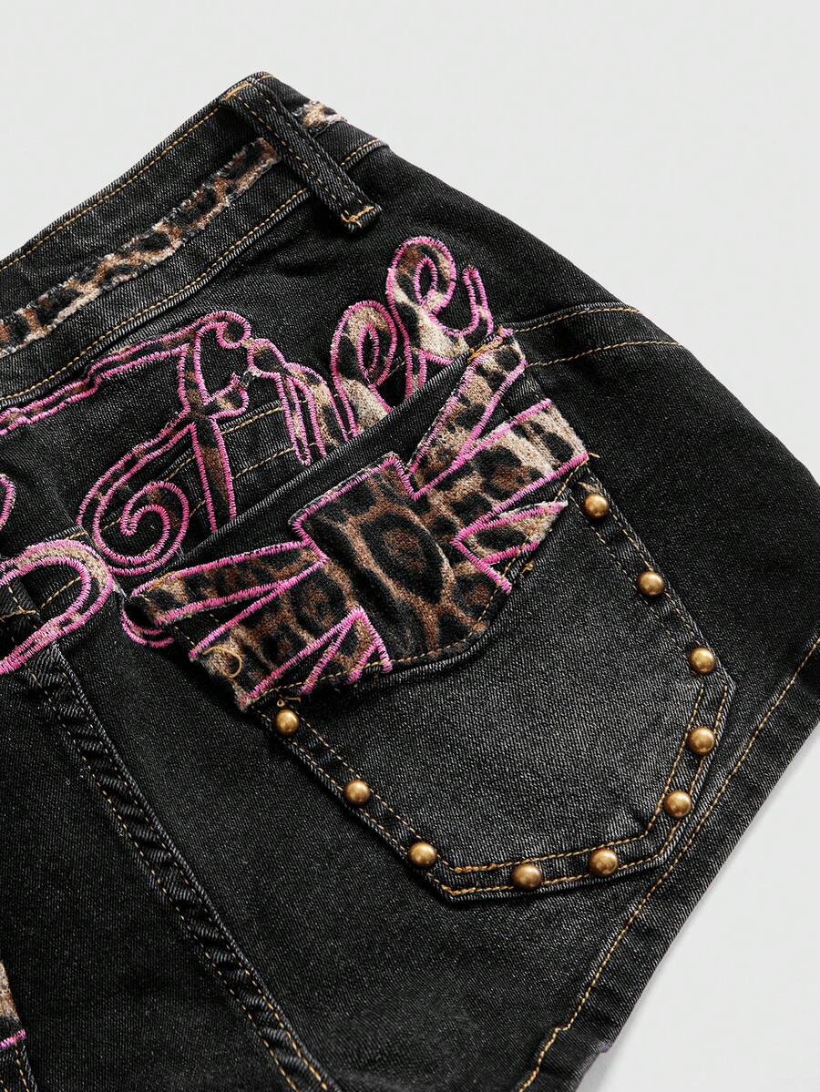 Women's super low waist shorts with leopard print embroidery, button and zipper closure, and raw hem detailing.