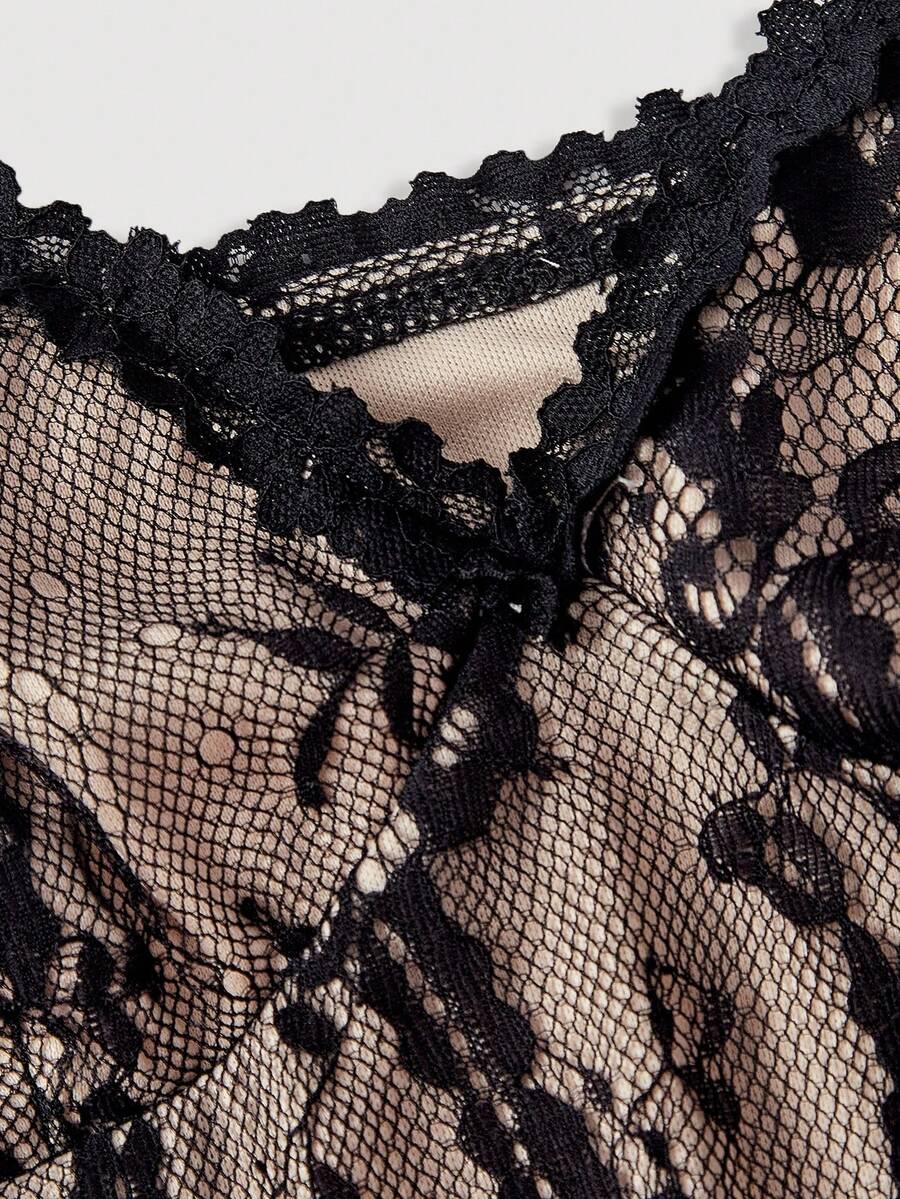 Women's short lace cami dress with spaghetti straps, contrast lace detailing, high waist, slim fit, and straight hem.