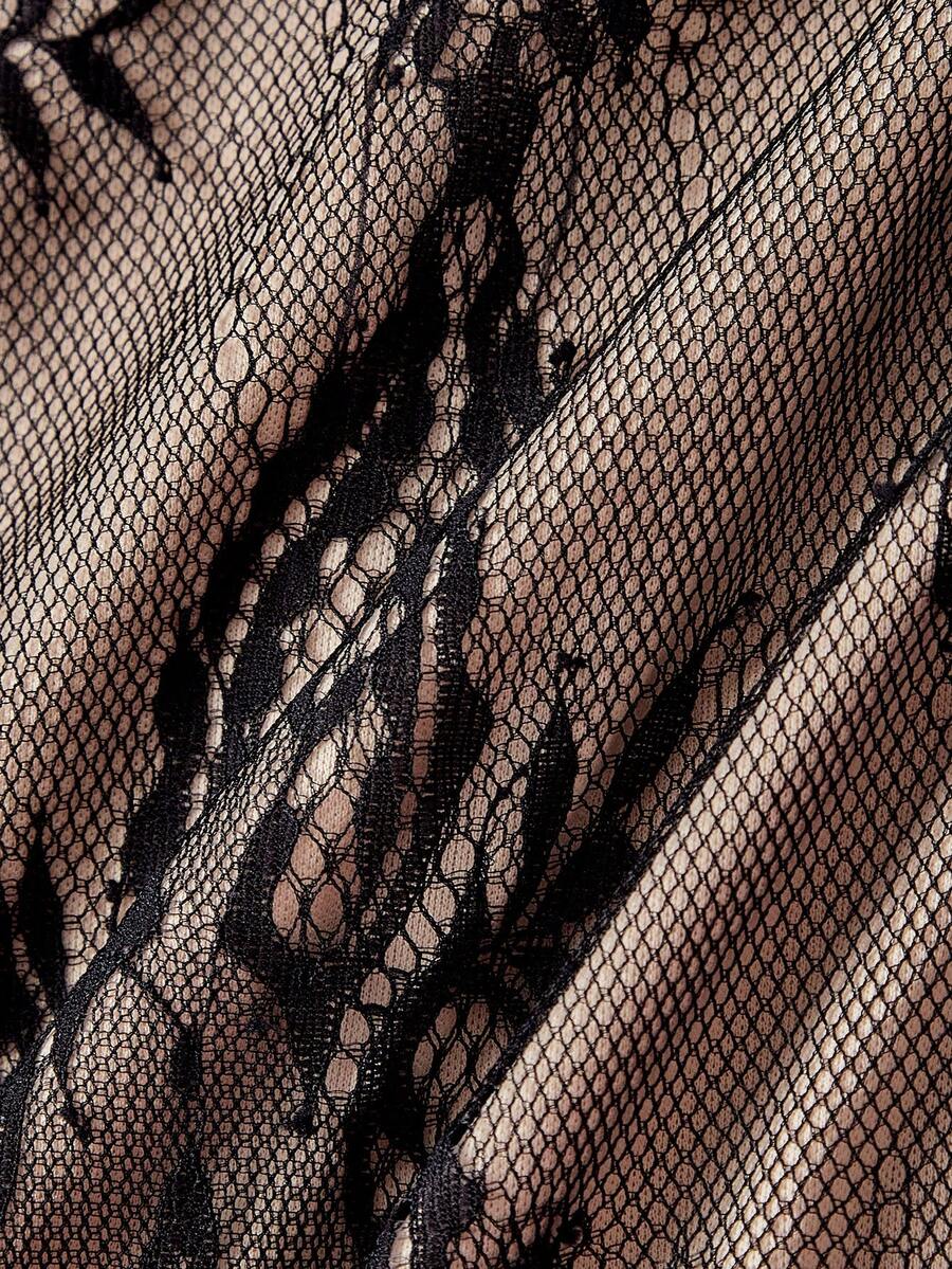 Women's short lace cami dress with spaghetti straps, contrast lace detailing, high waist, slim fit, and straight hem.