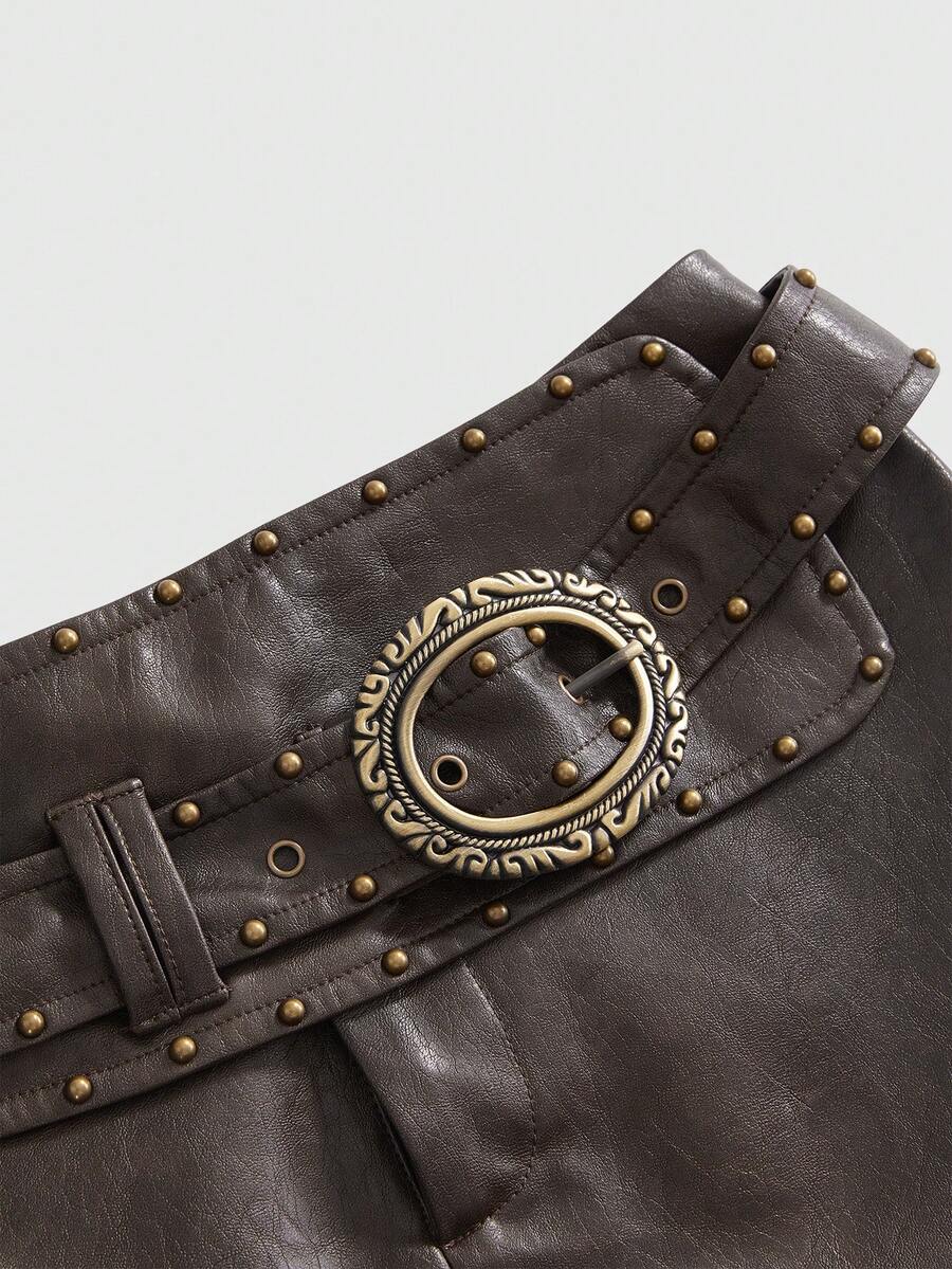 Brown ultra low waist PU bodycon mini shorts for women featuring studded rivet embellishments and a front zipper fly.
