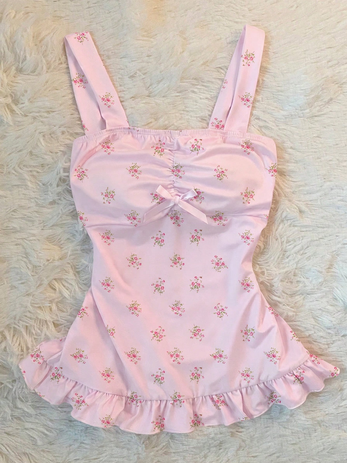 Women's retro slim-fit crop top featuring wide straps, ruched shirred detailing, asymmetrical ruffle hem, and cute bow accent.