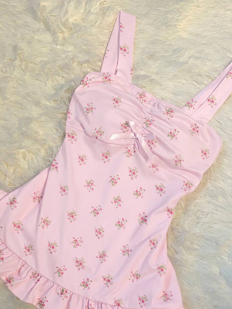 Women's retro slim-fit crop top featuring wide straps, ruched shirred detailing, asymmetrical ruffle hem, and cute bow accent.