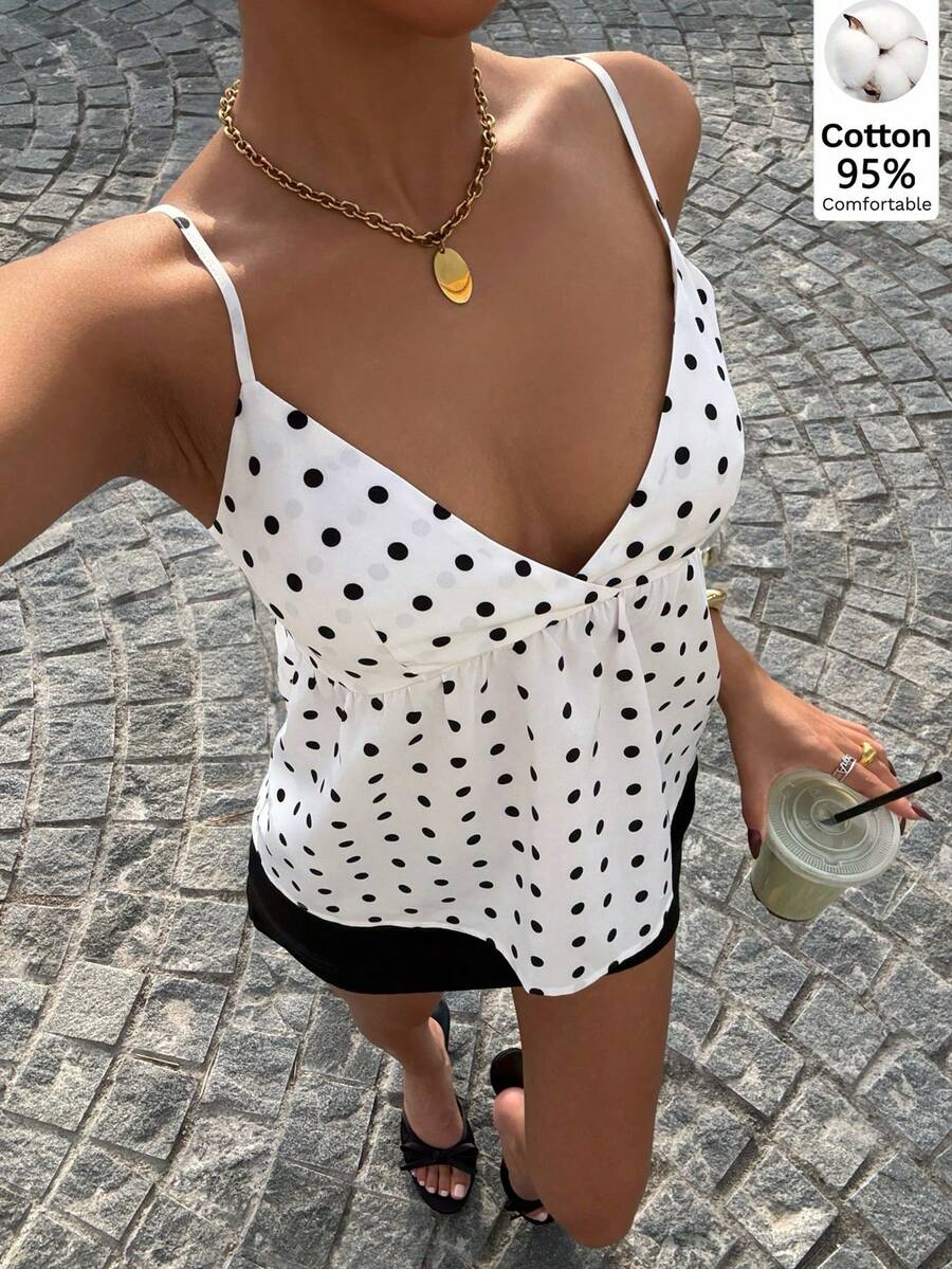 Women's casual geometric cami top with spaghetti straps, backless wrap styling, button front, and asymmetrical hem.
