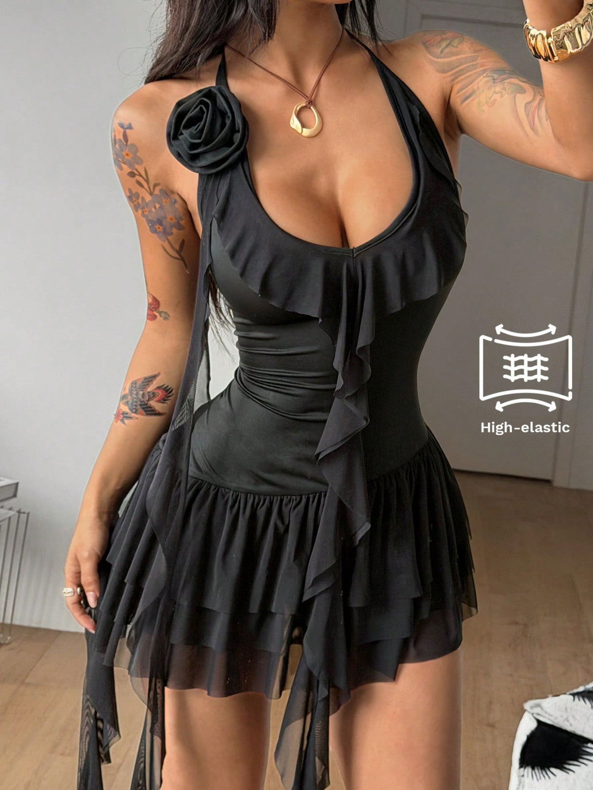 Black sleeveless mesh halter bodycon mini dress for women with flounce ruffle hem and striped pattern.