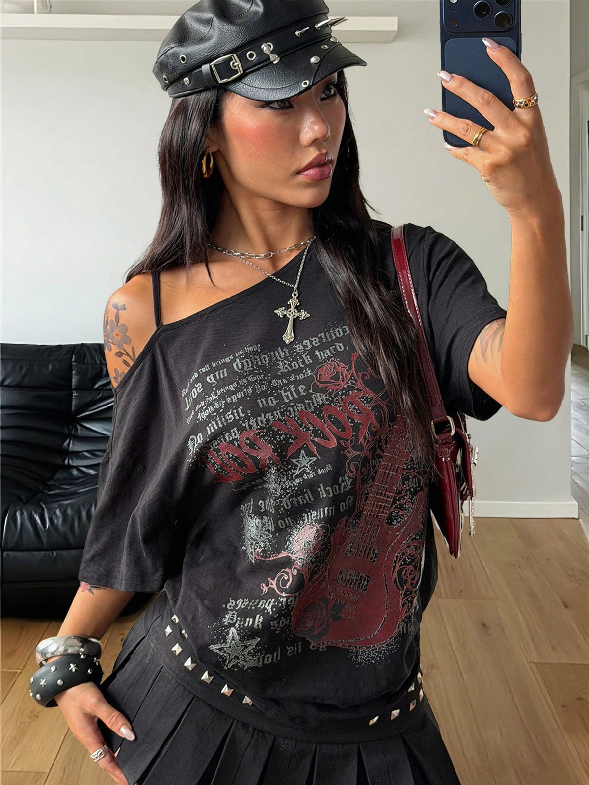 Women's casual loose fit cold shoulder cotton t-shirt with asymmetrical cutout neckline and short sleeves.