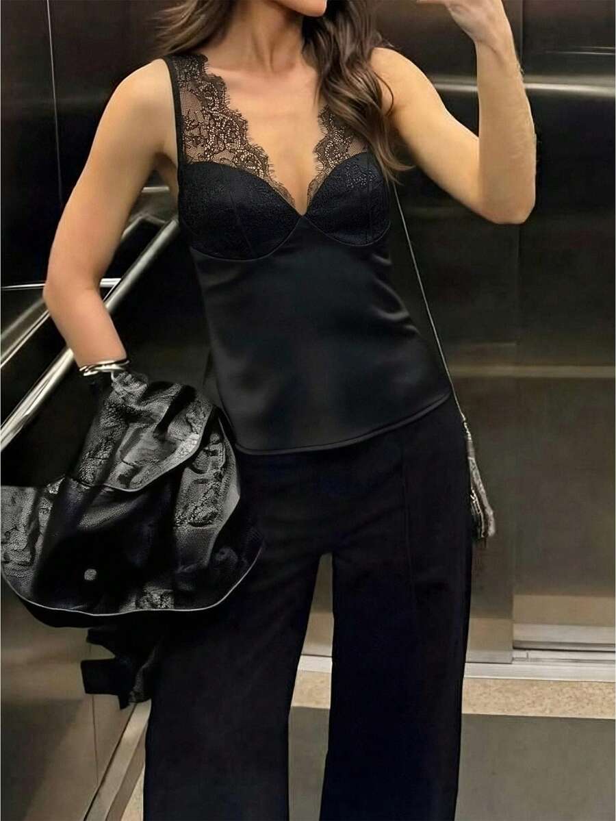 Women's black sleeveless camisole top with contrast lace trim along a deep V-neckline and wide shoulder straps.