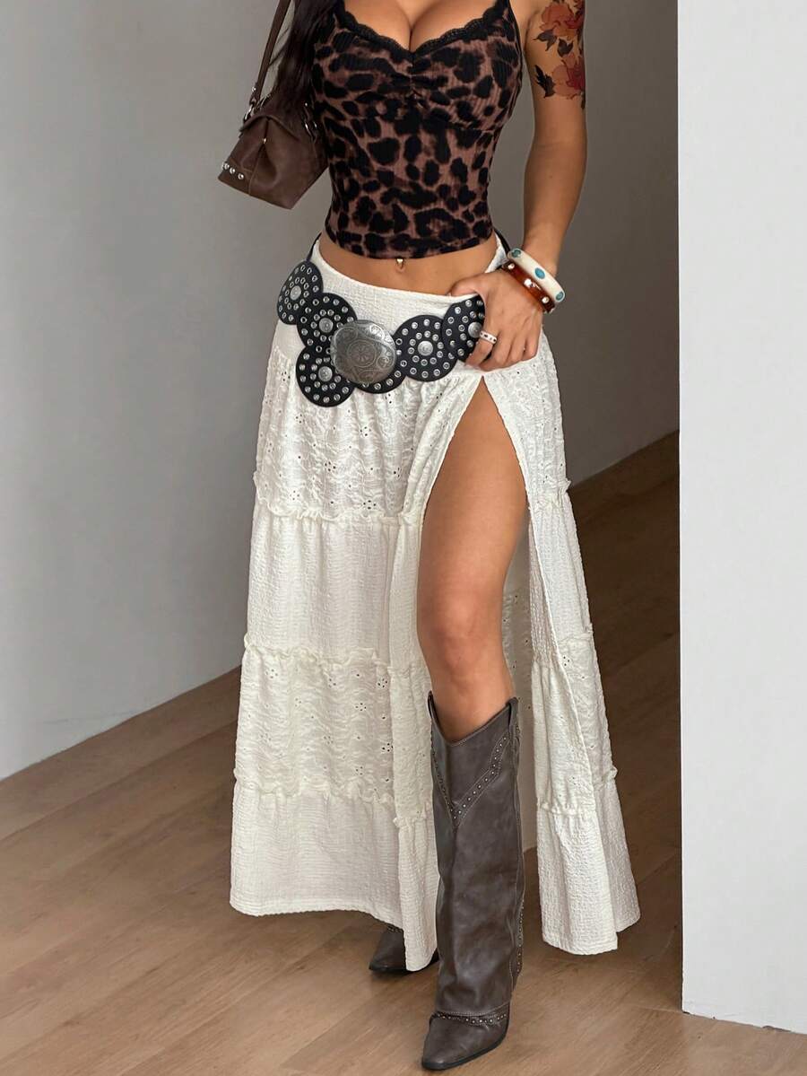 Women's red plaid long skirt featuring a low-rise waist and a side slit in lightweight woven fabric.