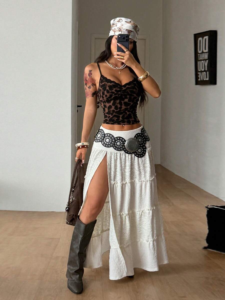 Women's red plaid long skirt featuring a low-rise waist and a side slit in lightweight woven fabric.