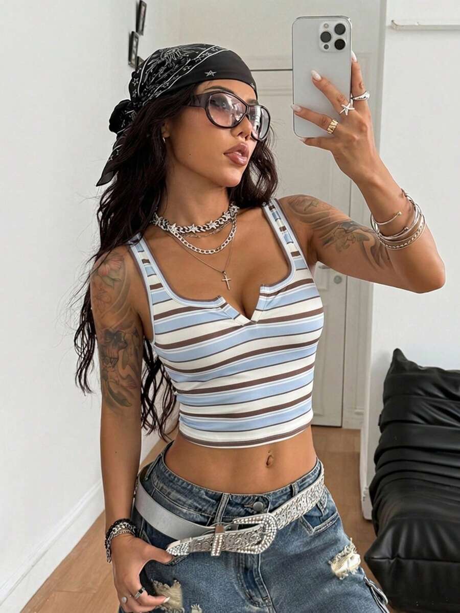 Women's striped rib-knit crop tank top with a notched neckline and slim fit.
