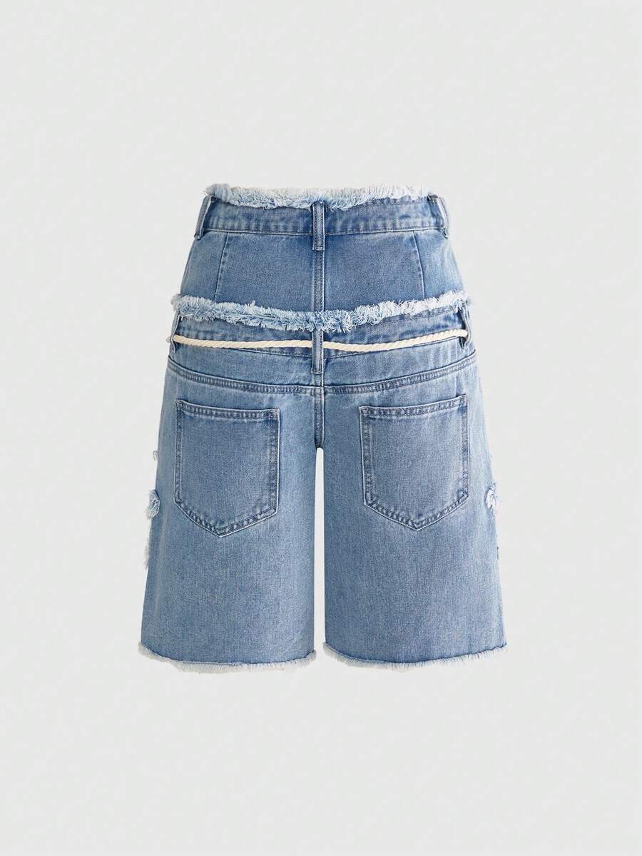 Women's blue denim bermuda shorts featuring a double waistband, star patch detail, ripped accents, and zipper fly closure.