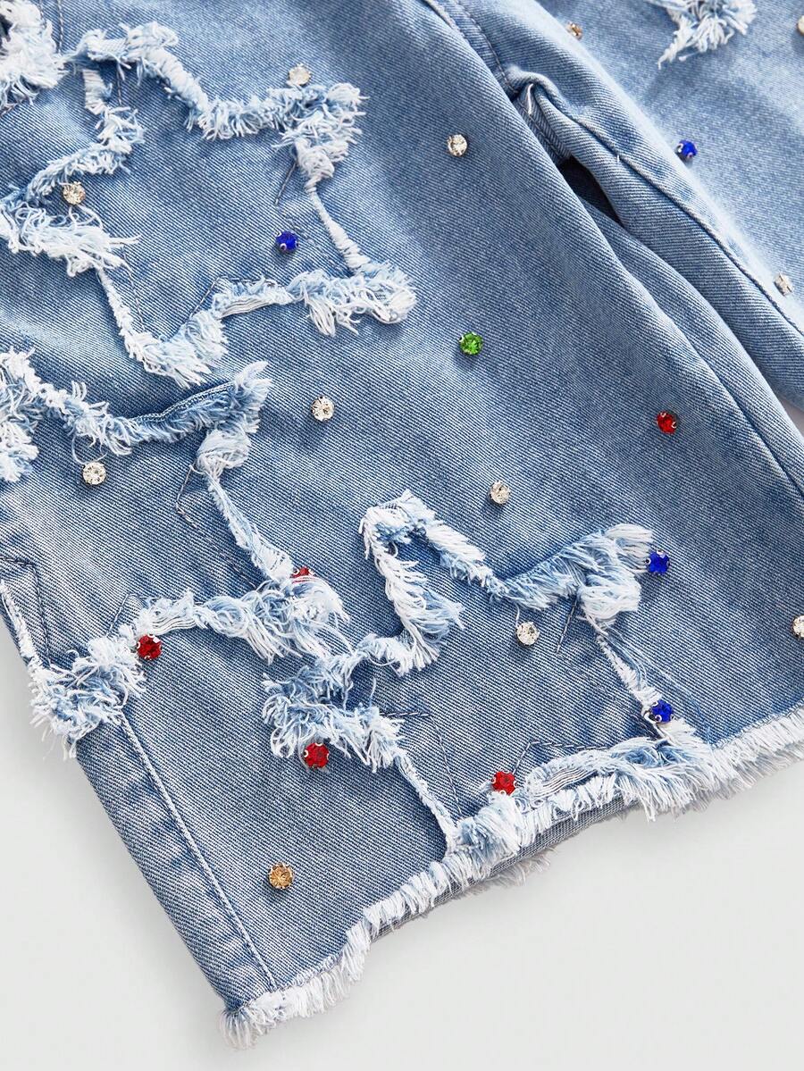 Women's blue denim bermuda shorts featuring a double waistband, star patch detail, ripped accents, and zipper fly closure.