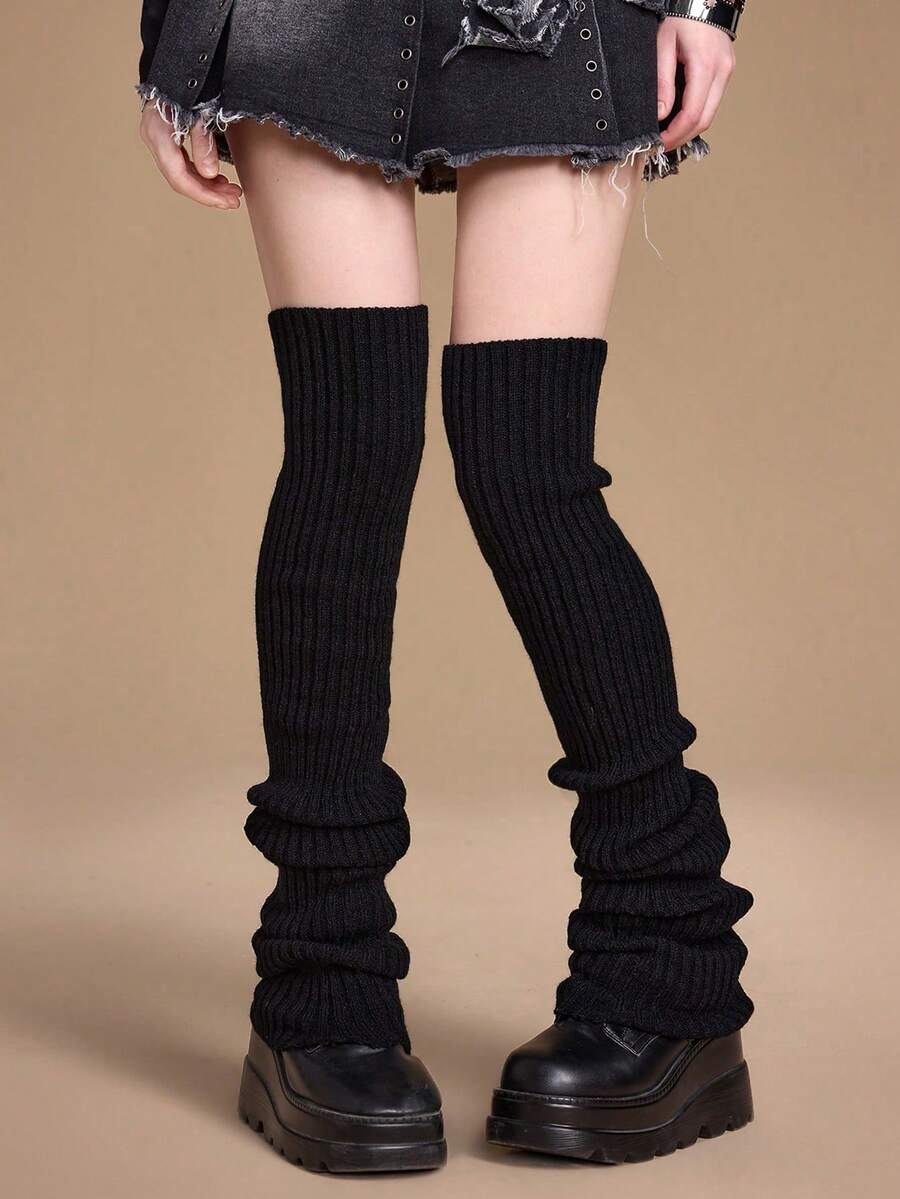 Pair of women's extra long knitted leg warmers featuring a gothic grunge design with subtle ruffle detailing.